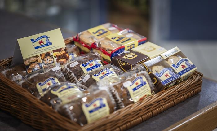 Basket display of traditional Welsh cakes, bara brith and shortbread from a local Welsh bakery.